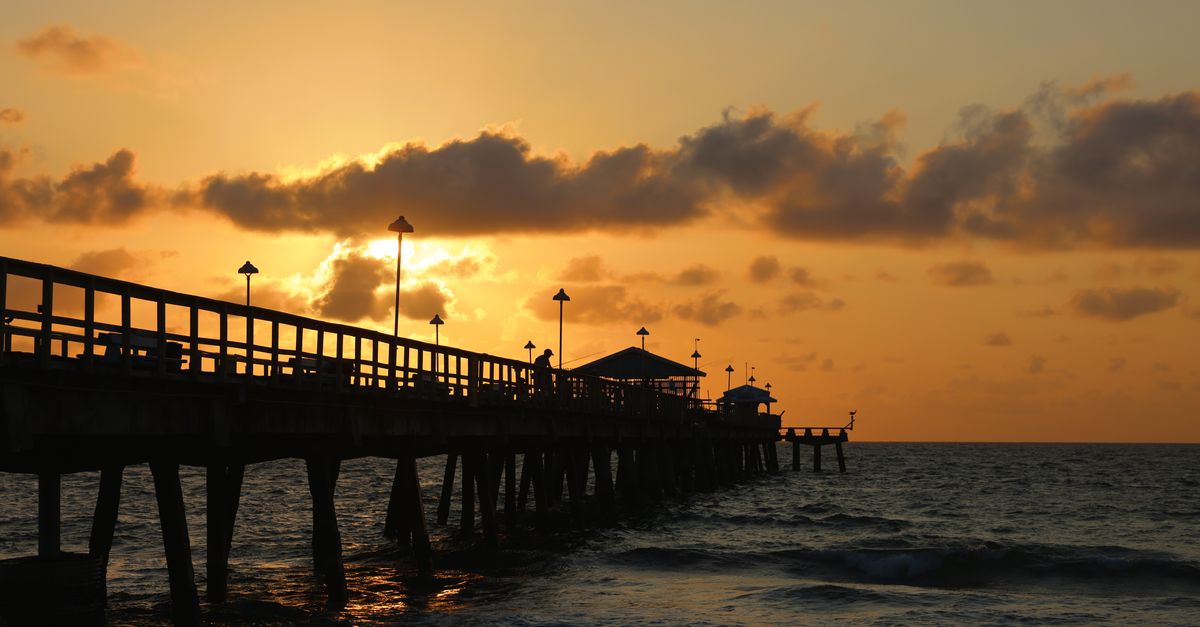 A pier at sunset over the Gulf
